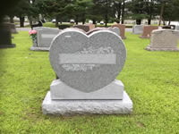 Heart-shaped granite gravestone memorial